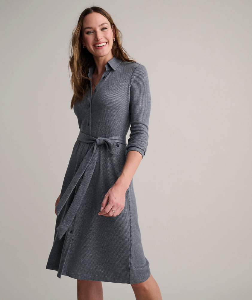 Model is wearing UNTUCKit Blyth dress in solid gray. 