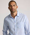 Model is wearing UNTUCKit Boyd  light blue stripe linen shirt.  