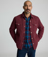 Model is wearing UNTUCKit Braunfield shirt jacket in Maroon. 