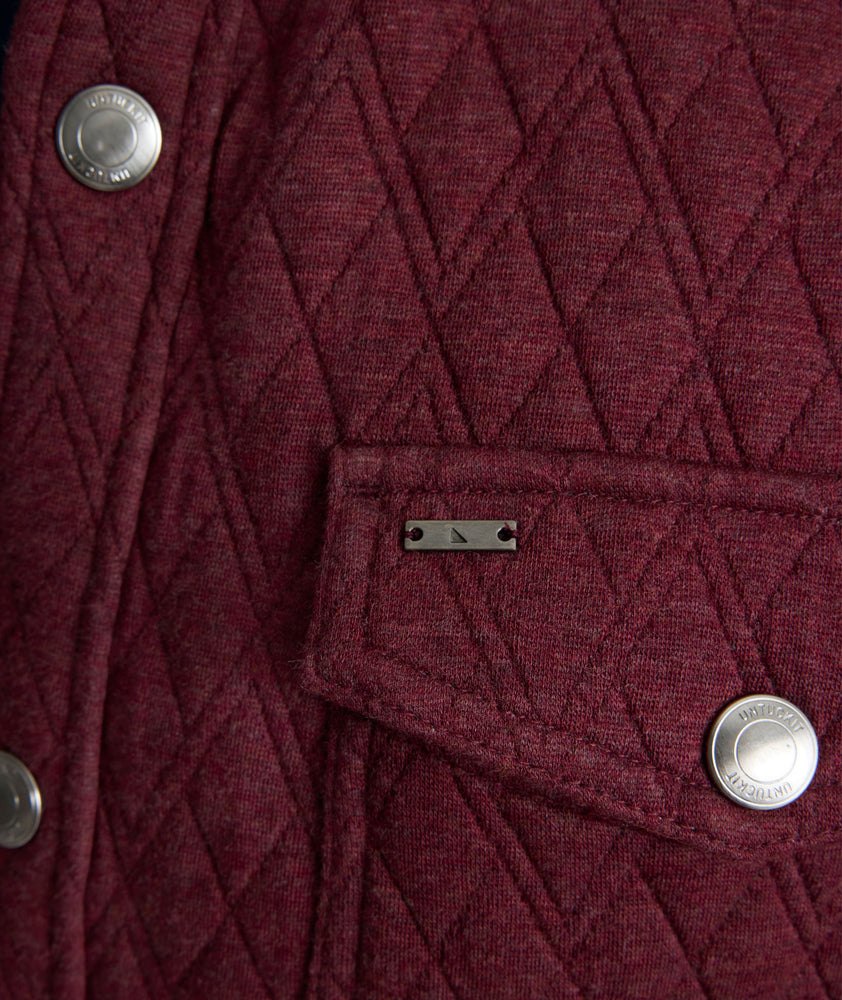 Model is wearing UNTUCKit Braunfield shirt jacket in Maroon. 