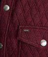 Model is wearing UNTUCKit Braunfield shirt jacket in Maroon. 