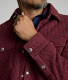 Model is wearing UNTUCKit Braunfield shirt jacket in Maroon. 