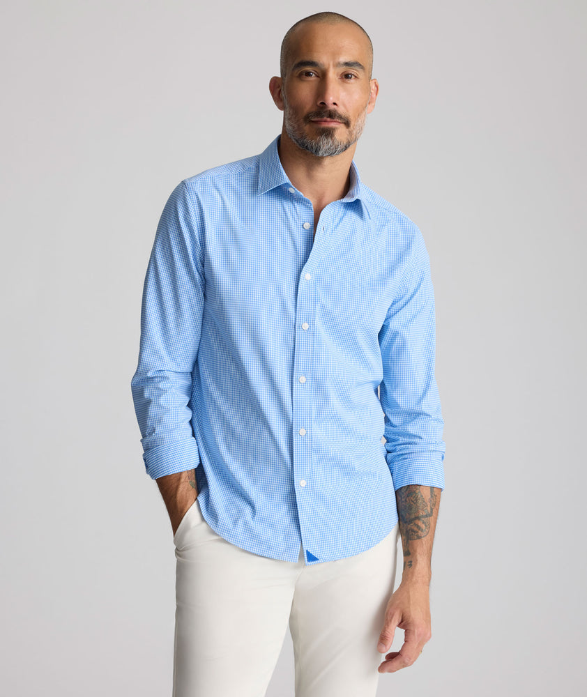 Model is wearing Performance Bravo Shirt in blue. 