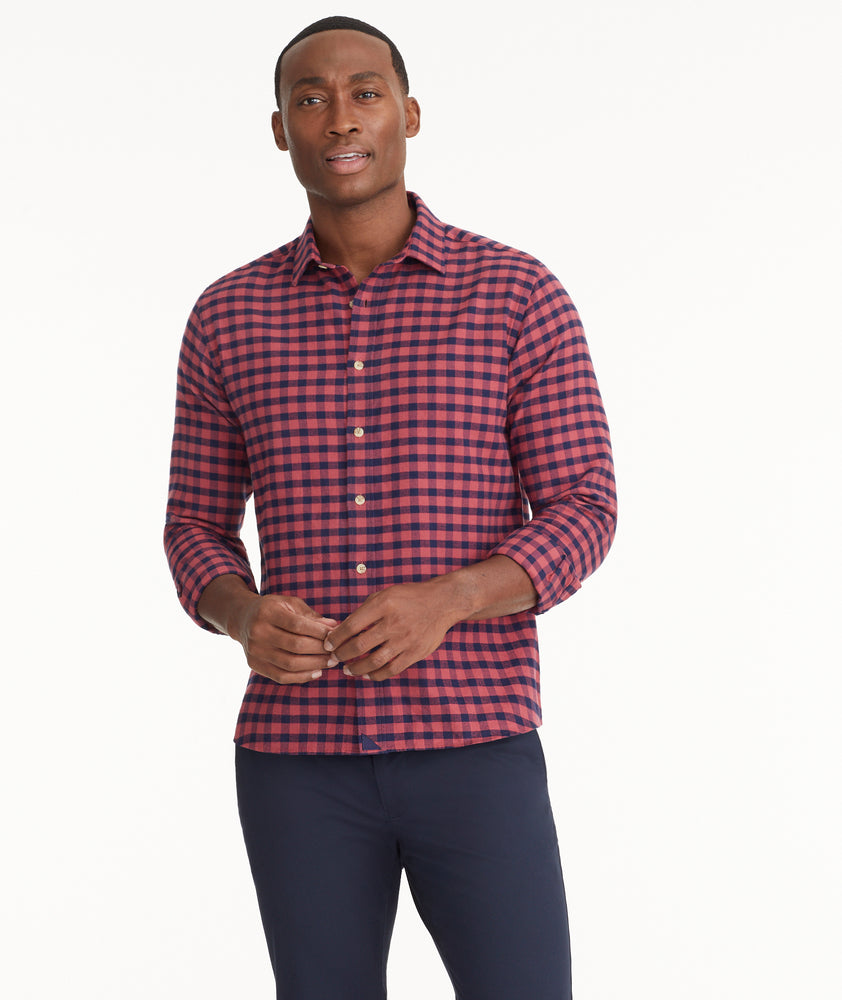 Model is wearing UNTUCKit Flannel Bricco Shirt in Berry & Navy Gingham.