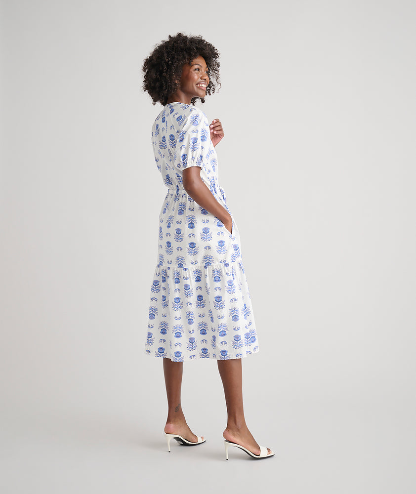 Model is wearing UNTUCKit Brigitte dress in floral white print. 