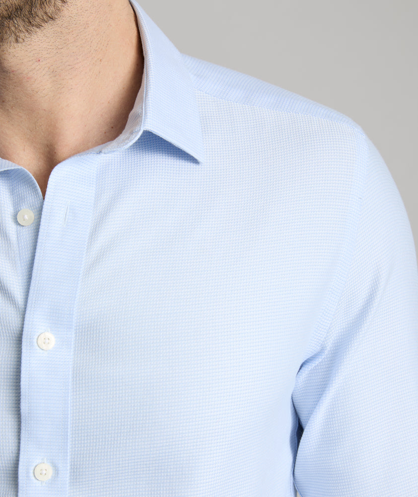 Model is wearing UNTUCKit burke in blue. 