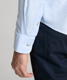 Model is wearing UNTUCKit burke in blue. 