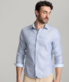 Model is wearing UNTUCKit burke in blue. 