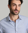 Model is wearing UNTUCKit burke in blue. 