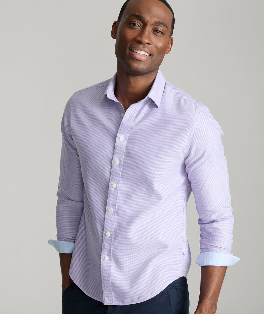Model is wearing UNTUCKit Burke shirt in purple. 