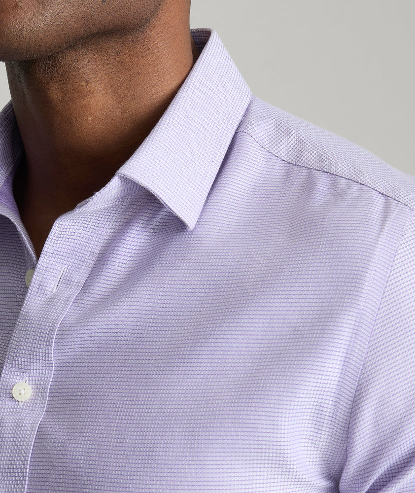 Model is wearing UNTUCKit Burke shirt in purple. 