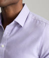 Model is wearing UNTUCKit Burke shirt in purple. 