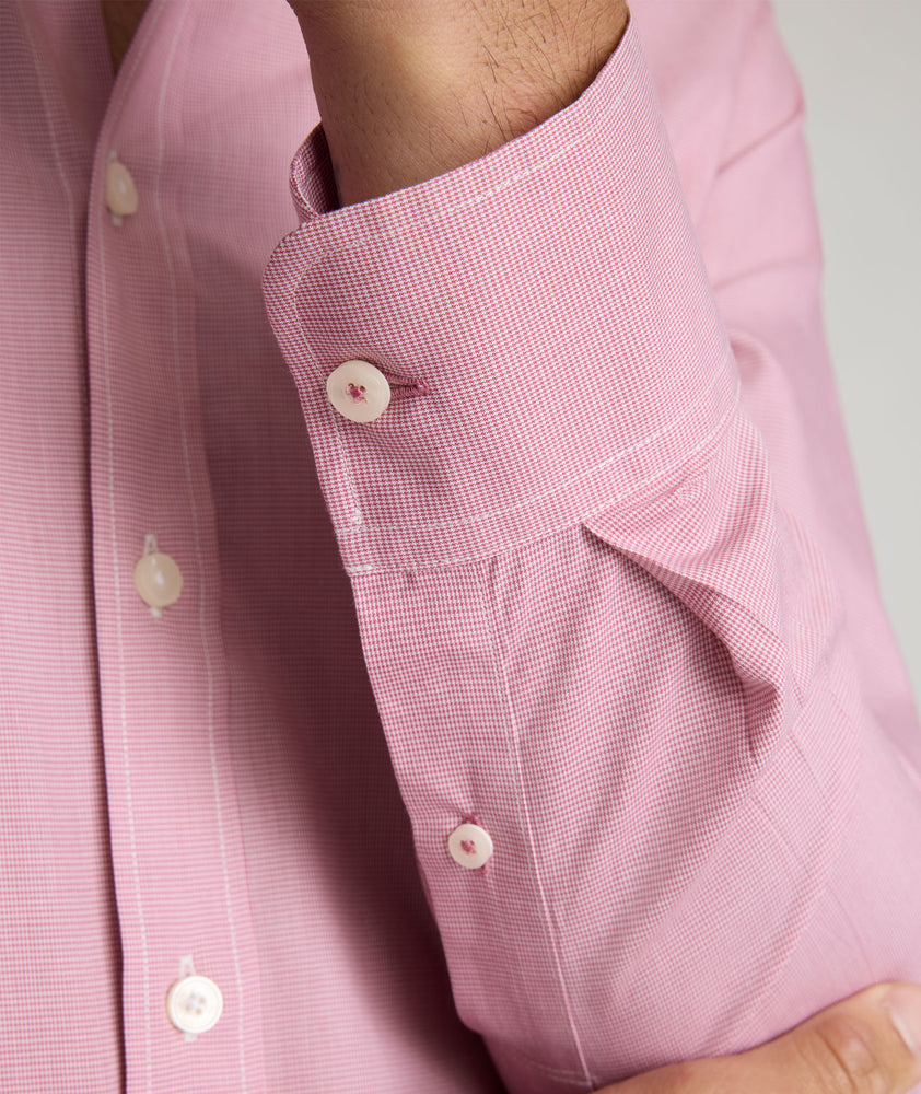 Model is wearing UNTUCKit Cadetto wrinkle-free shirt in rose wine. 