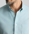 Model is wearing UNTUCKit Wrinkle-Free Cadetto Shirt in Light Green.