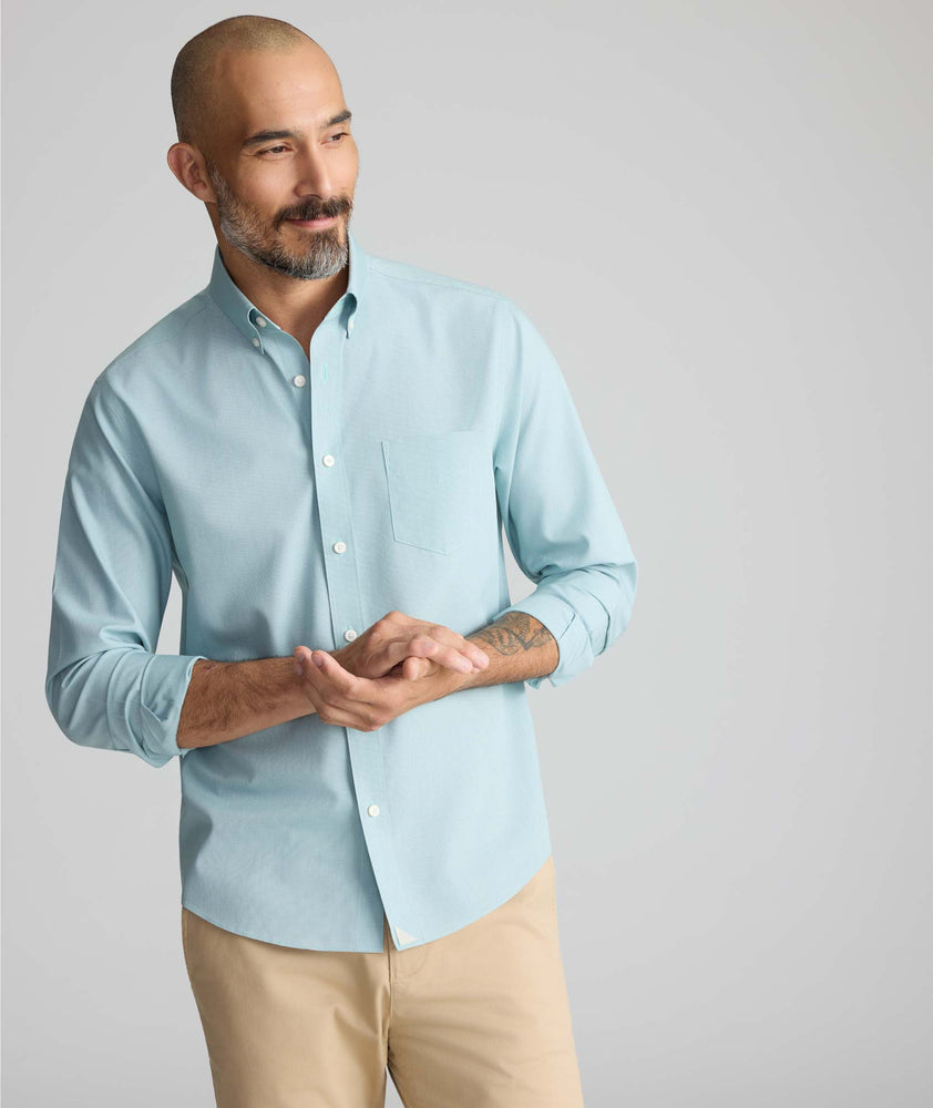 Model is wearing UNTUCKit Wrinkle-Free Cadetto Shirt in Light Green.