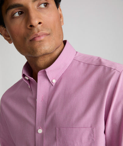 Model wearing an UNTUCKit Mid Red Wrinkle-Free Cadetto Shirt.