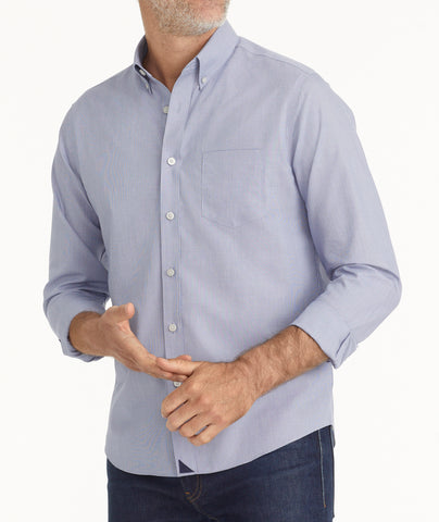 Model is wearing UNTUCKit Wrinkle-Free Cadetto Shirt in Navy.
