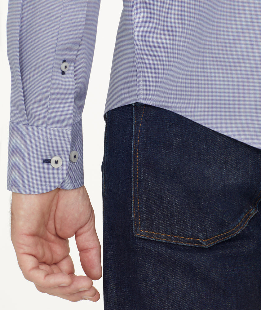 Model is wearing UNTUCKit Wrinkle-Free Cadetto Shirt in Navy.