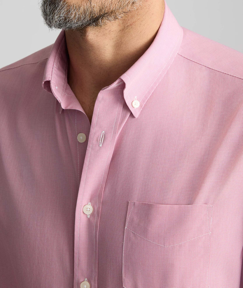 Model is wearing UNTUCKit Cadetto wrinkle-free shirt in rose wine.