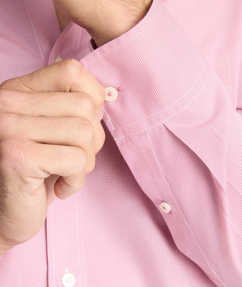 Model is wearing UNTUCKit Cadetto wrinkle-free shirt in rose wine.