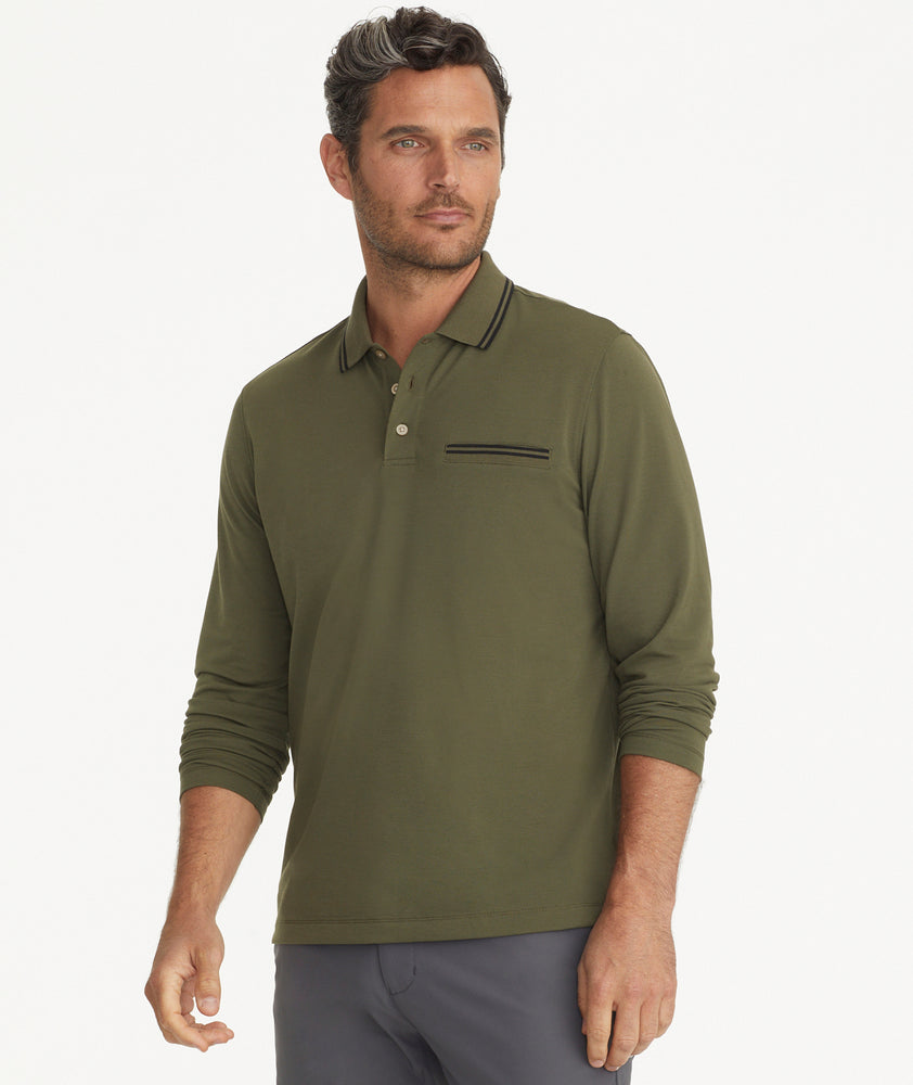Model is wearing UNTUCKit Ceasar long sleeve polo in ivy green.