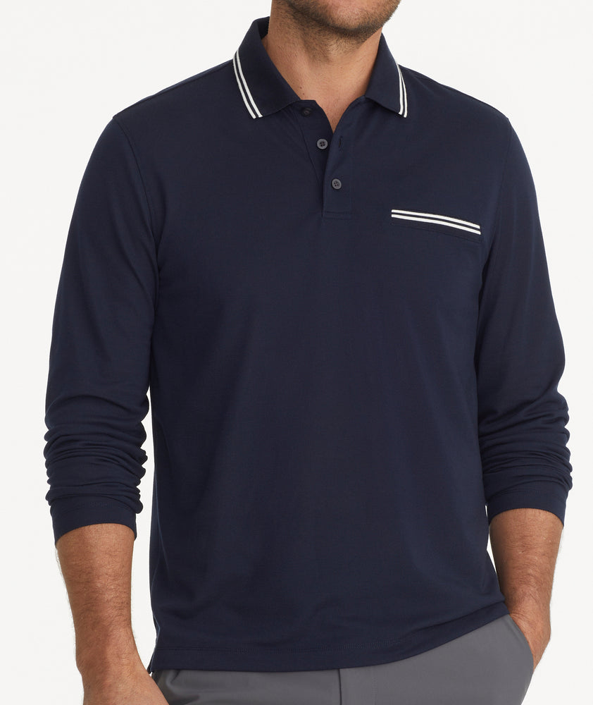 Model is wearing UNTUCkit Caesar LS Polo in Sky Captain.