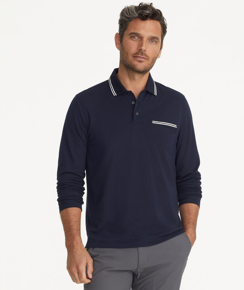 Model is wearing UNTUCkit Caesar LS Polo in Sky Captain.