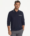 Model is wearing UNTUCkit Caesar LS Polo in Sky Captain.