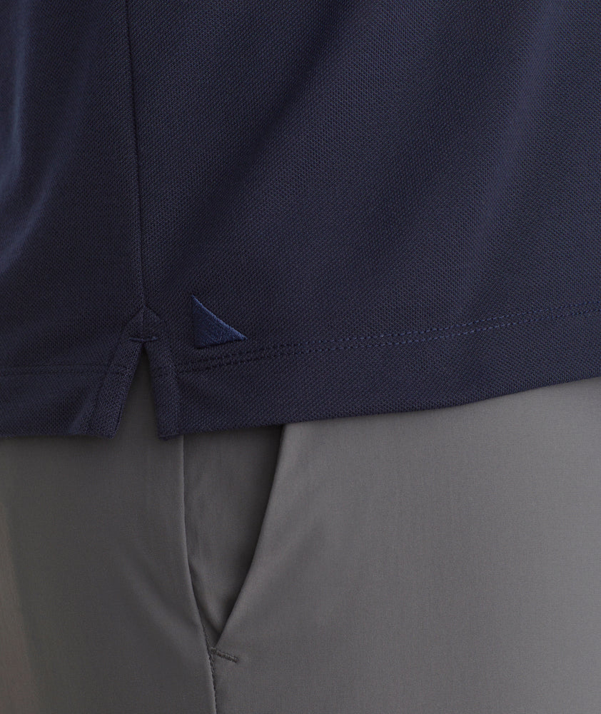 Model is wearing UNTUCkit Caesar LS Polo in Sky Captain.