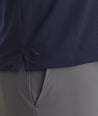 Model is wearing UNTUCkit Caesar LS Polo in Sky Captain.