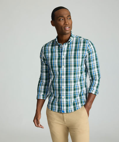 Model is wearing UNTUCKit Caldwell shirt in green large plaid.