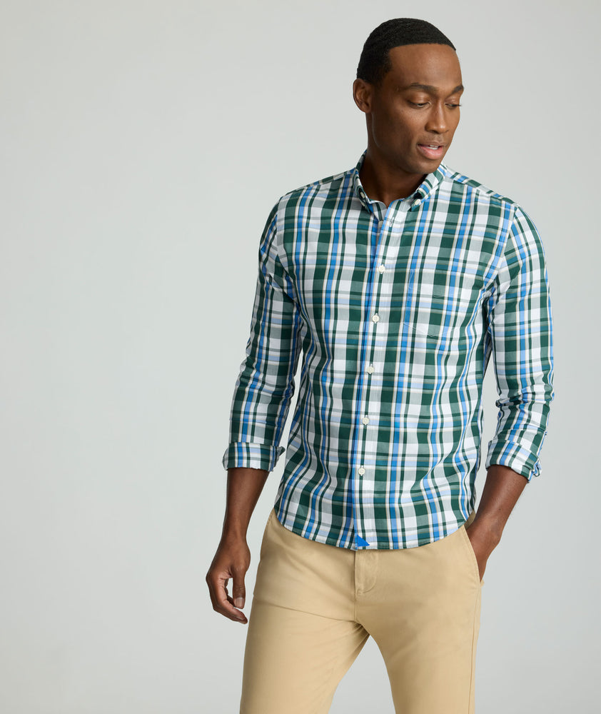 Model is wearing UNTUCKit Caldwell shirt in green large plaid.