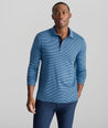 Model is wearing UNTUCKit Wrinkle-Free Damaschino Long-Sleeve Polo in Steel Blue Stripe. 