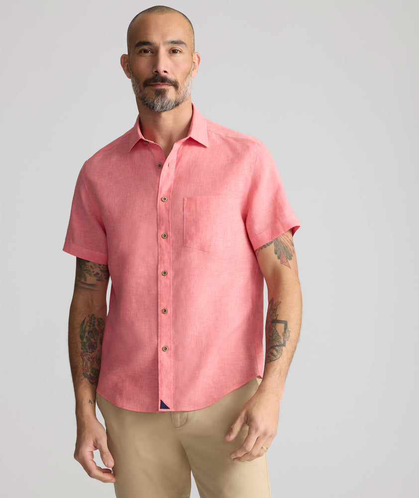 Model is wearing UNTUCKit Cameron Shirt in cayenne. 