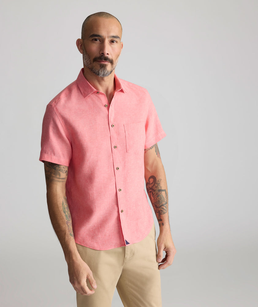 Model is wearing UNTUCKit Cameron Shirt in cayenne. 