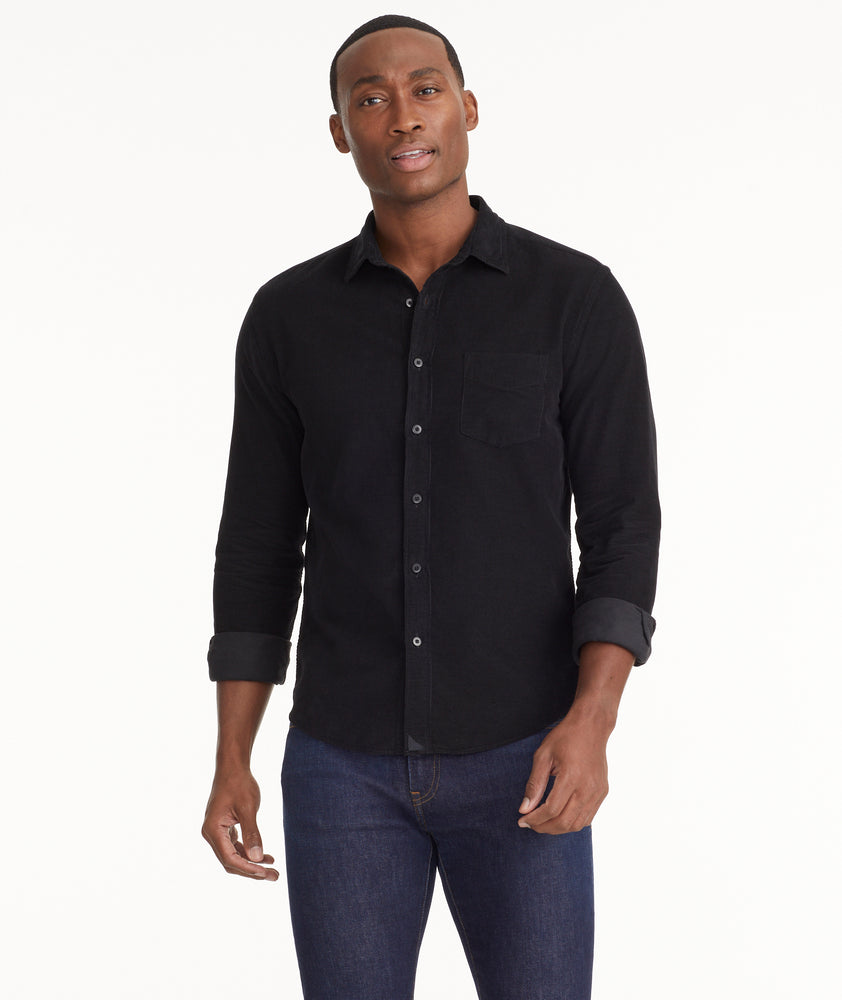 Model is wearing UNTUCKit Cord Shirt in black.