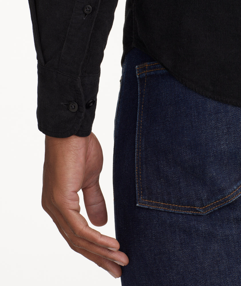 Model is wearing UNTUCKit Cord Shirt in black.