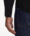 Model is wearing UNTUCKit Cord Shirt in black.