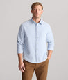 Model is wearing UNTUCKit Cord Shirt in heather blue. 