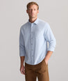 Model is wearing UNTUCKit Cord Shirt in heather blue. 