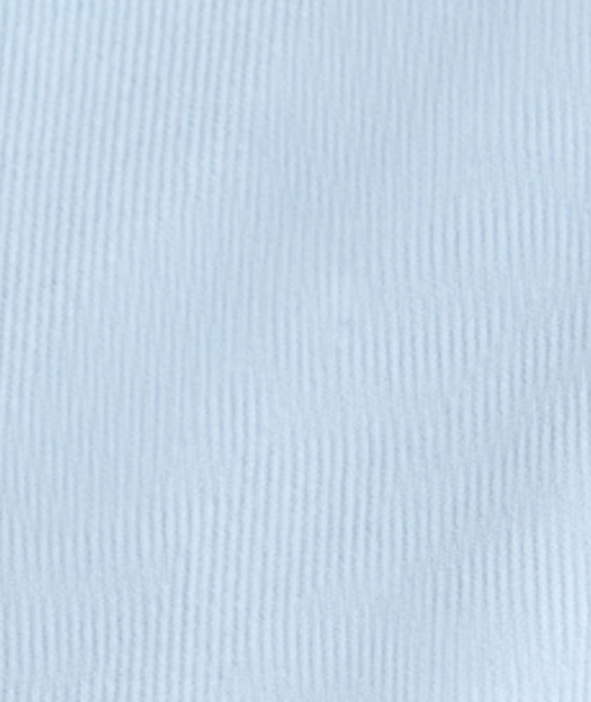 Model is wearing UNTUCKit Cord Shirt in heather blue. 