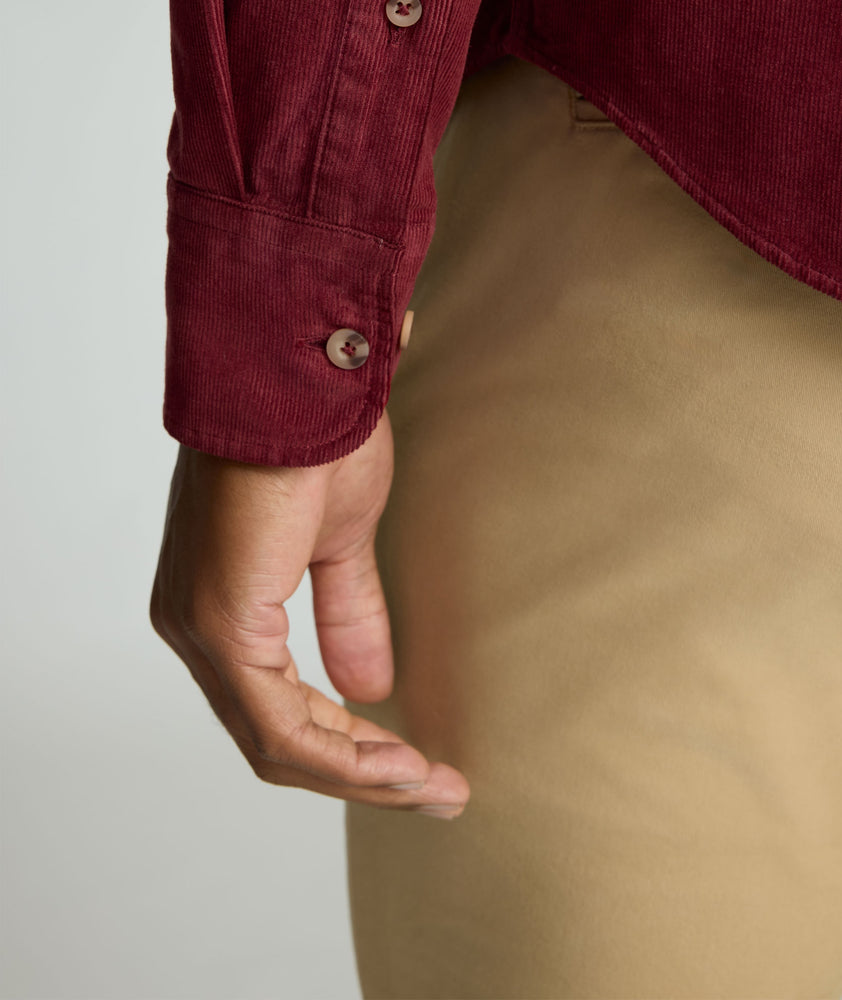 Model is wearing UNTUCKit Cord Shirt in Syrah.