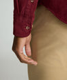 Model is wearing UNTUCKit Cord Shirt in Syrah.