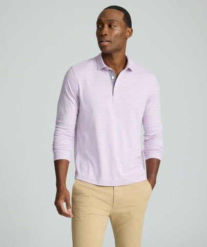 Model is wearing UNTUCKit Wrinkle-Free Long-Sleeve Polo in Heather Lavendula.