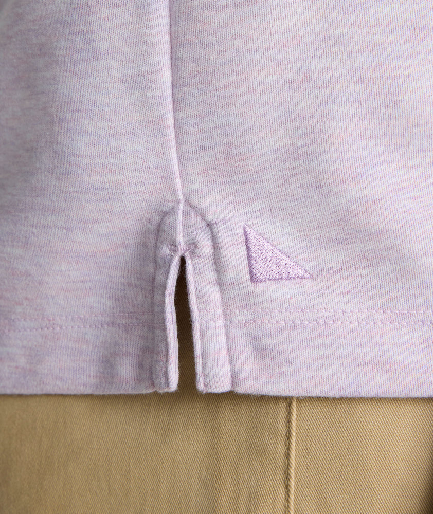 Model is wearing UNTUCKit Wrinkle-Free Long-Sleeve Polo in Heather Lavendula.