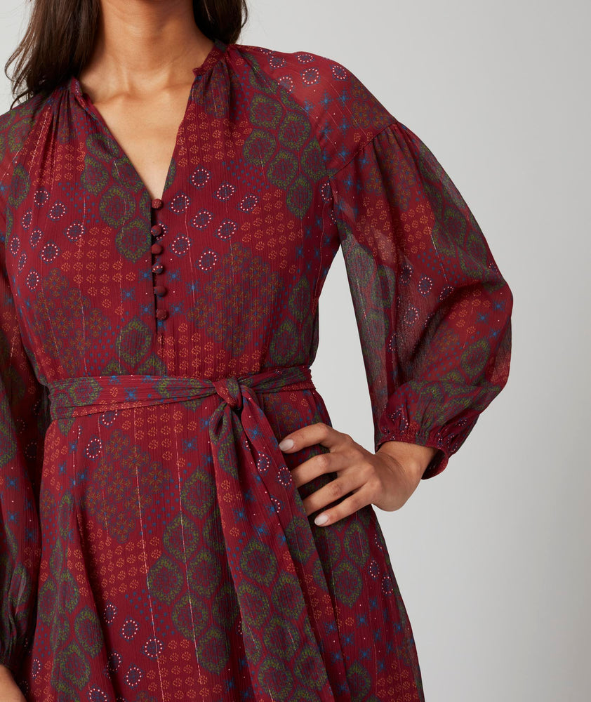 Model is wearing UNTUCKit Carly printed red dress.