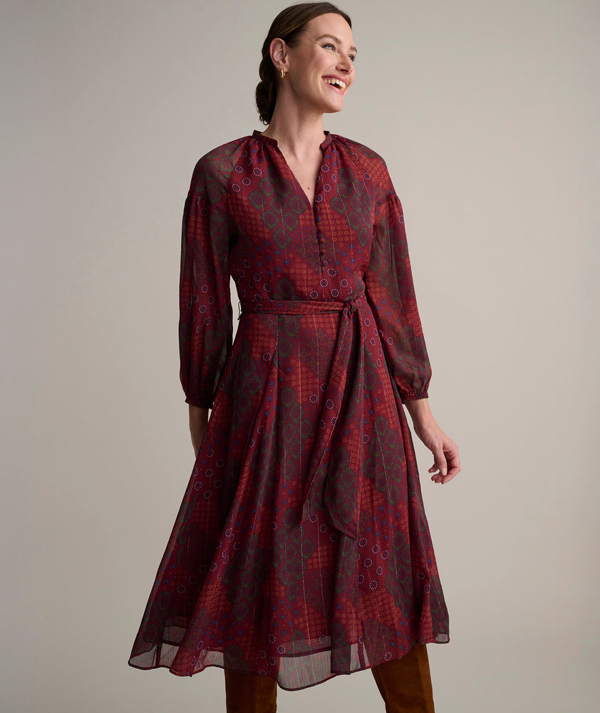 Model is wearing UNTUCKit Carly printed red dress. 