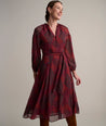 Model is wearing UNTUCKit Carly printed red dress. 