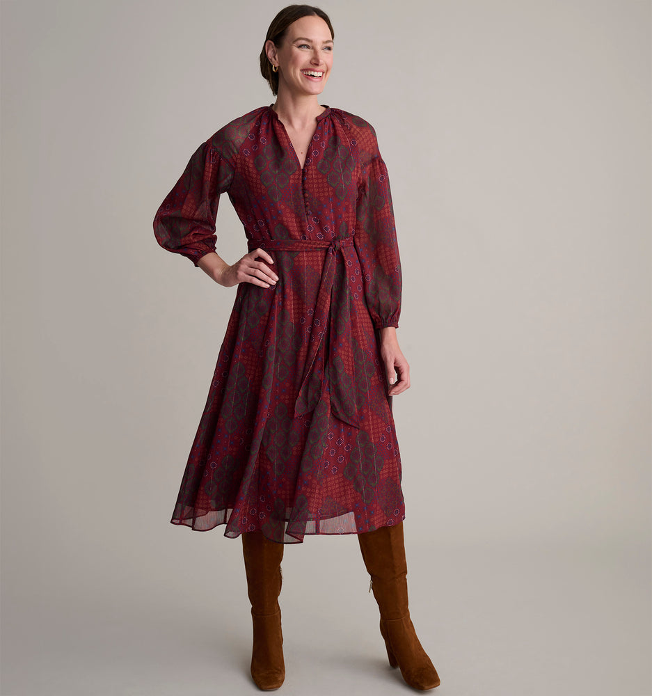 Model is wearing UNTUCKit Carly printed red dress. 
