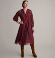 Model is wearing UNTUCKit Carly printed red dress. 